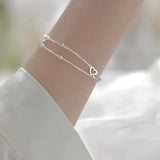 Adjustable bracelet with heart in silver