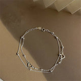 Adjustable bracelet with heart in silver