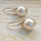 Elegant earrings with drop-shaped pearls