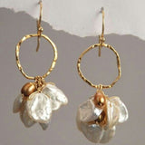 Golden earrings with vintage pearls and dangling flowers