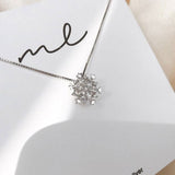 Crystal Necklace with Shimmering Snowflake in Gold and Silver