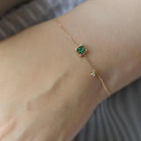 Gold Bracelet with Green Crystal