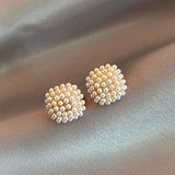 Elegant Gold Earrings with Inlaid Pearls