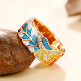 Vintage gold ring with coloured enamel leaf