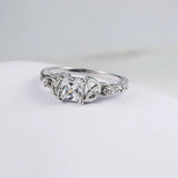 Ring with Knot Design and Silver Gemstone in the Centre
