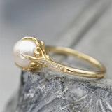 Vintage ring with a golden pearl in the centre