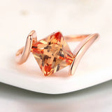 Ring with Orange Gemstone in Pyramid Cut in Rose Gold