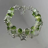 Vintage bracelet with silver butterfly and green beads