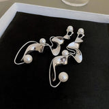 Abstract vintage silver earrings with pearls
