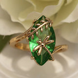 Ring with golden green gemstone and dragonfly