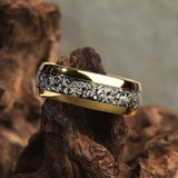 Ring with sparkling gold inlays